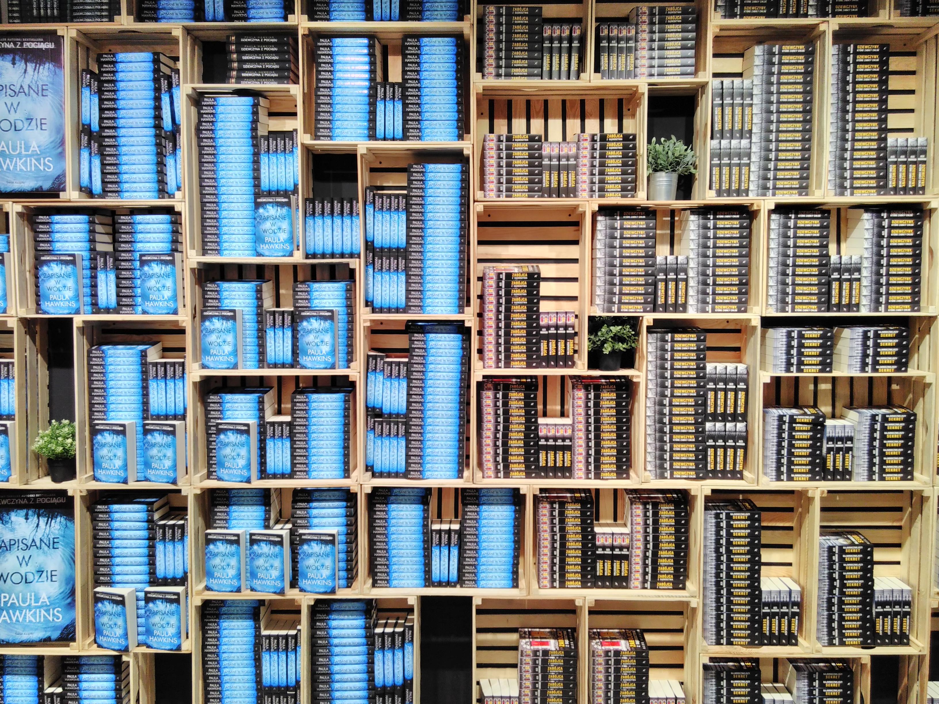A wall of book crates in a bookstore